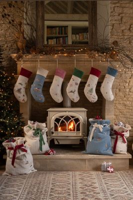 Festive décor for the season, trim the tree, hang the stockings, put the present sacks under the tree and light the candles