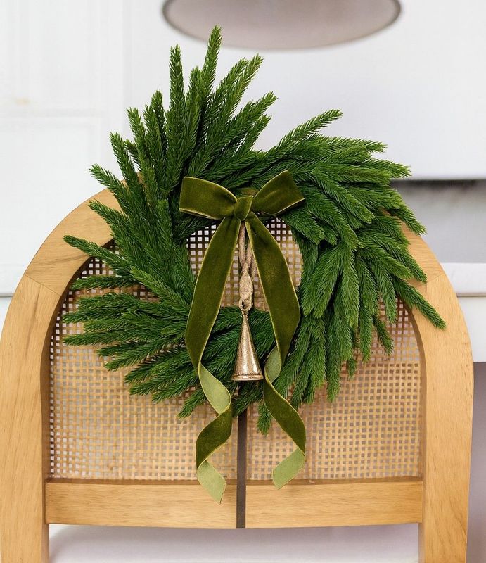 Norfolk Pine mini wreaths add a touch of festive greenery. Style with our velvet ribbons and rustic bells.