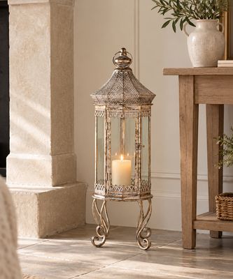 Antique Champagne Vire Lantern Tall antiqued metal ornate lantern for the perfect adornment to a bare corner of any room