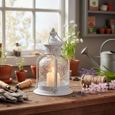 Fleur De Lys Lantern Ivory and glass Fleur De Lys Lantern is the perfect accent for a she-shed or patio. Place your candle in and bask in the glow