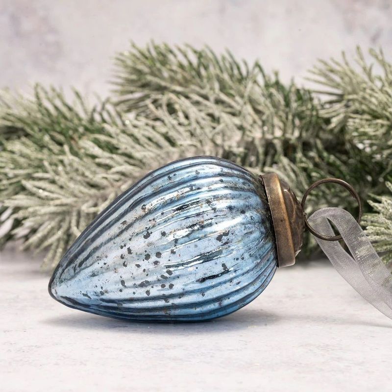 Create a truly magical Frozen theme with these icy blue topaz glass baubles