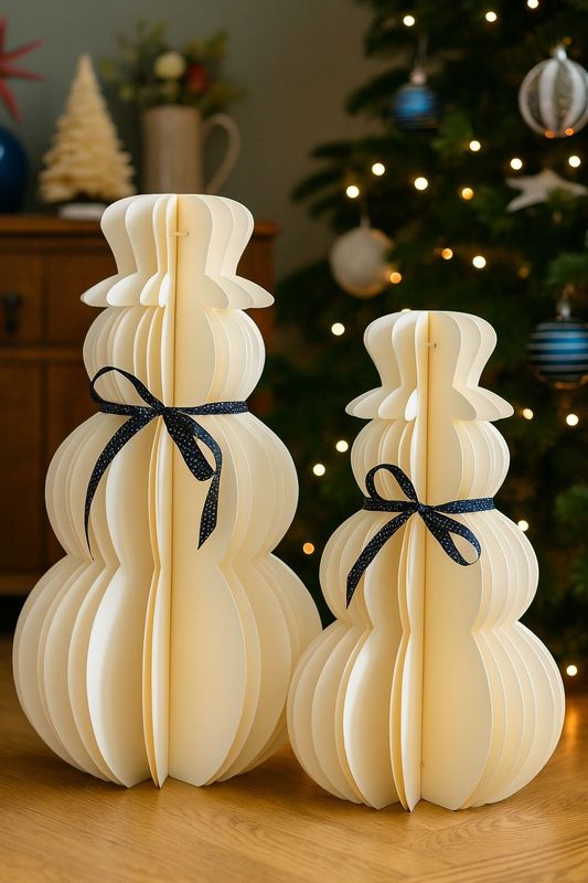 These stunning paper Snowman are laser cut from heavy duty white paper and lovingly assembled by hand.