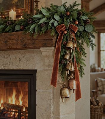 Make a stunning garland this Christmas mixing different sized hanging vintage bells and velvet ribbon