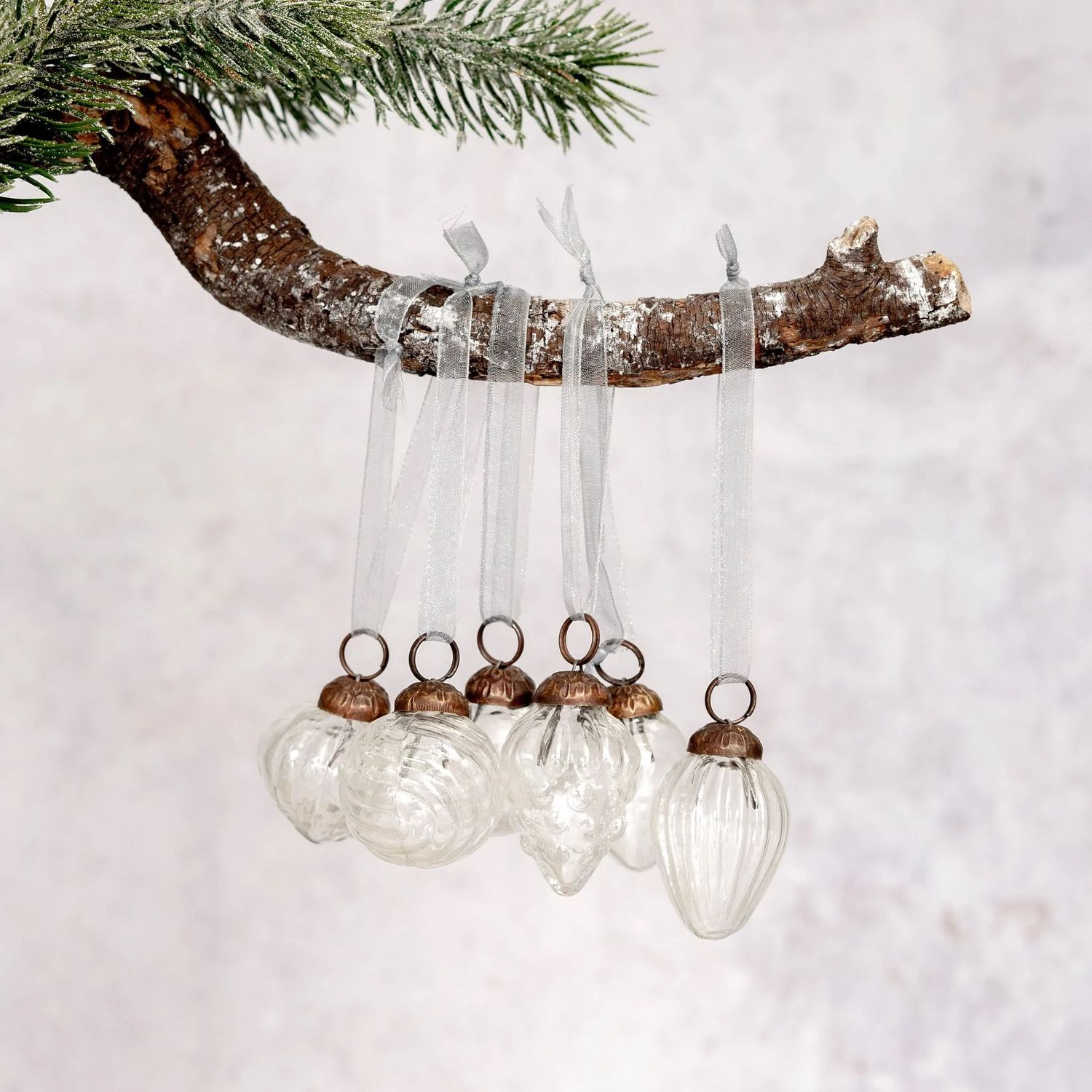 Clear Glass Lustre Baubles - Set of 6 Clear hand-blown lustre glass Christmas baubles. Mix of six different designs featuring an ornate antique cap & organza tie