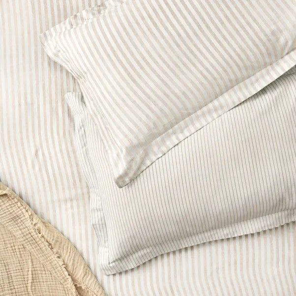 Natural creamy stripes on these crisp cotton pillowcases gives a vintage feel to a freshly made bed.