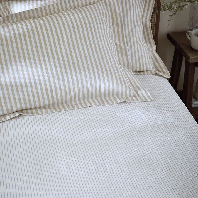 Hebden striped creamy beige fitted sheet. Breathable, lightweight smooth feel ensures ultimate comfort throughout the night.