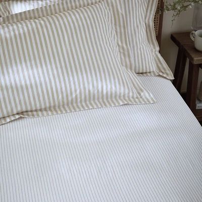 Hebden striped creamy beige fitted sheet. Breathable, lightweight smooth feel ensures ultimate comfort throughout the night.