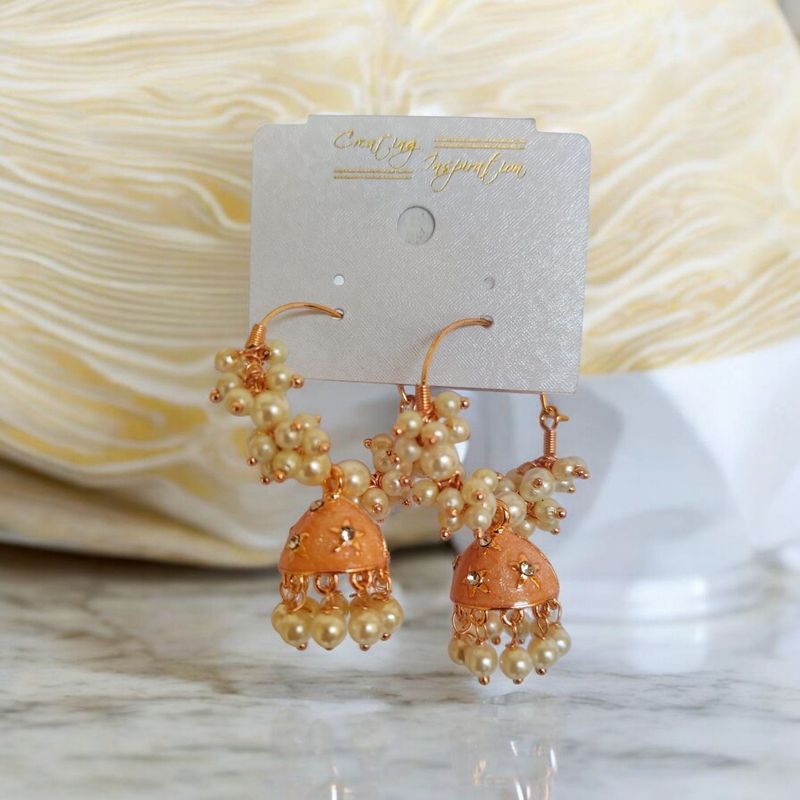 Peach ring jhumka earrings with white bead clusters