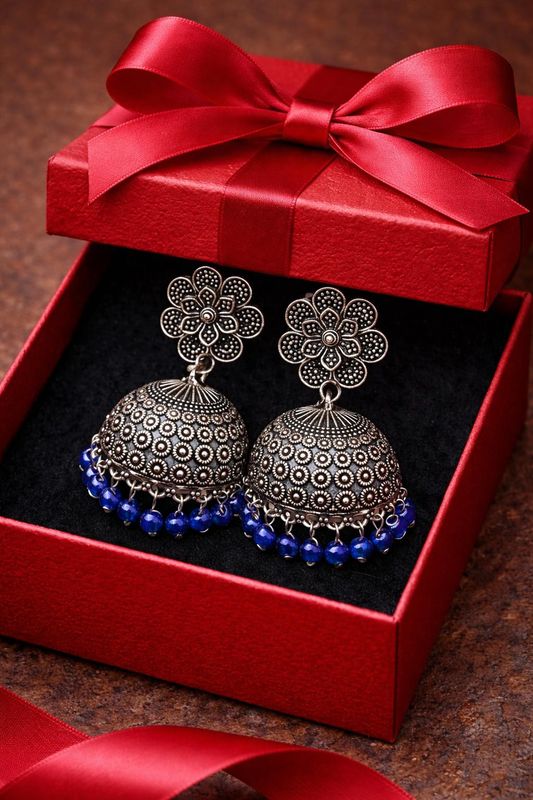 Silver-tone dome jhumka earrings with deep blue beaded border