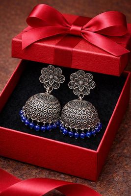Silver-tone dome jhumka earrings with deep blue beaded border