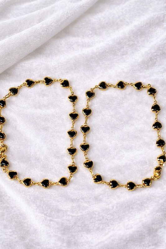 Black stone heart shaped gold tone anklet