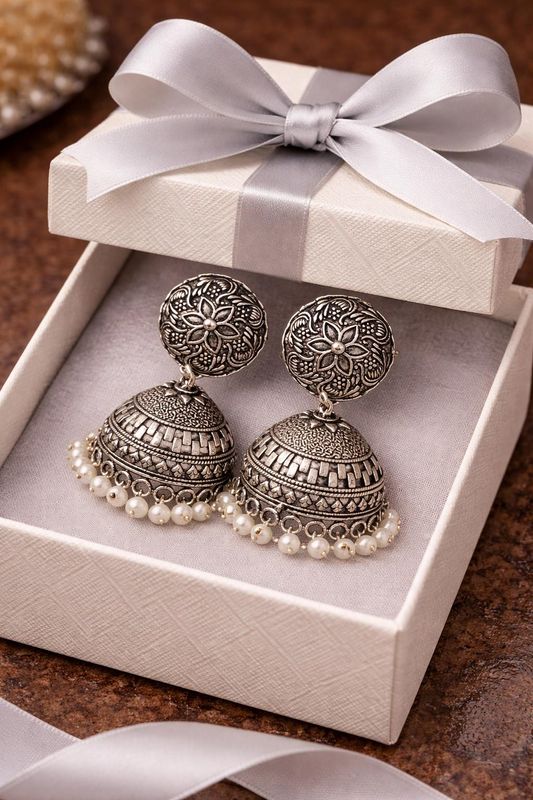 Silver-tone jhumka earrings with white pearl beading