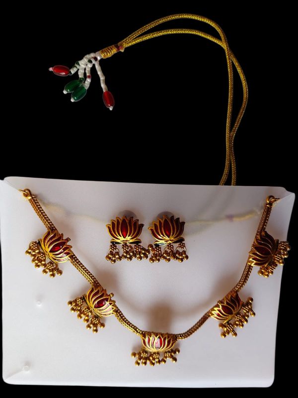 Gold-tone lotus pendant necklace set with matching earrings