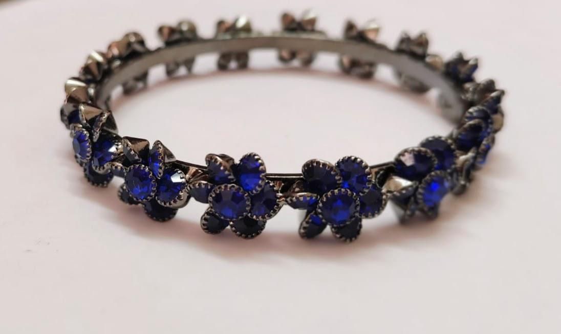 Dark metal bangles with deep blue stones