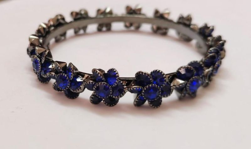 Dark metal bangles with deep blue stones