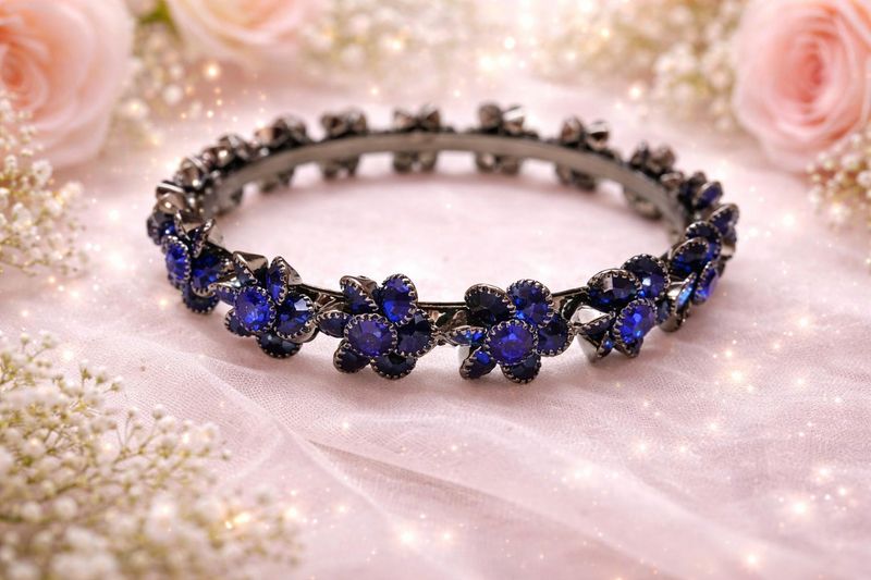 Dark metal bangles with deep blue stones