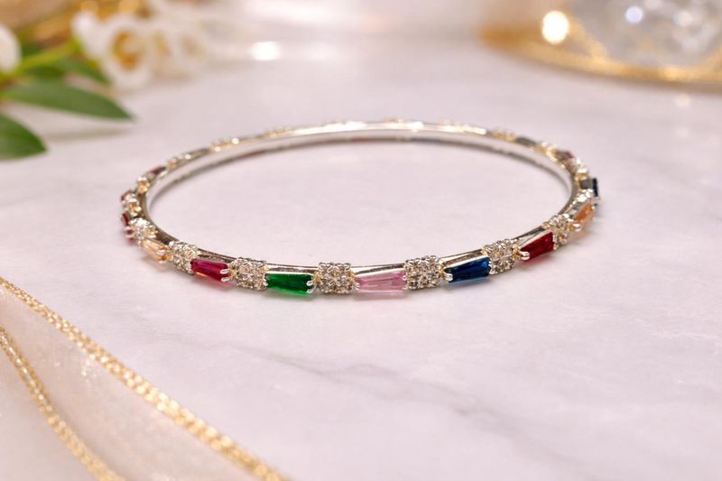 Silver-tone bangle with multicolour rectangular stones