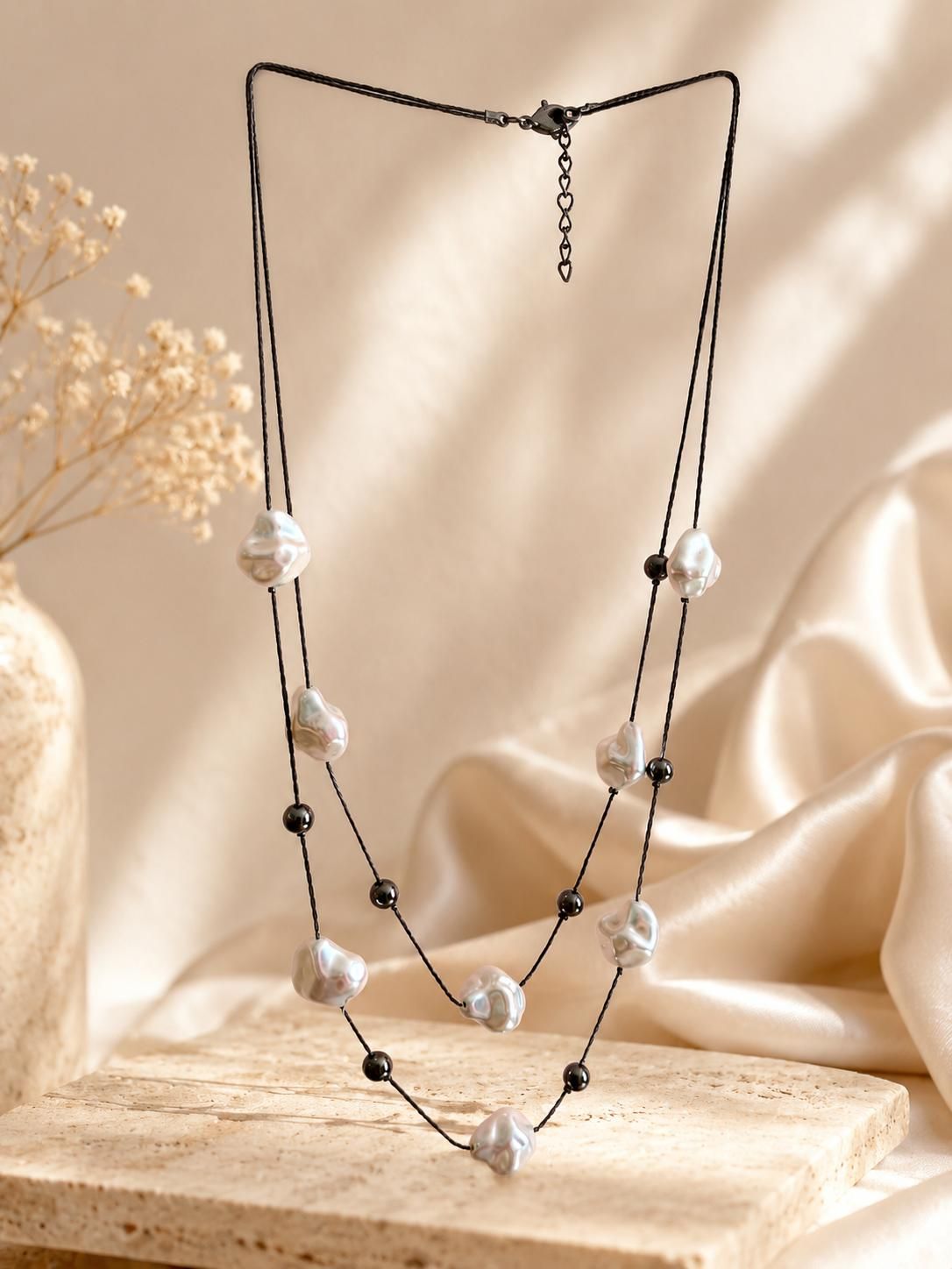 White and black  beaded neckchain with black tone bead chain