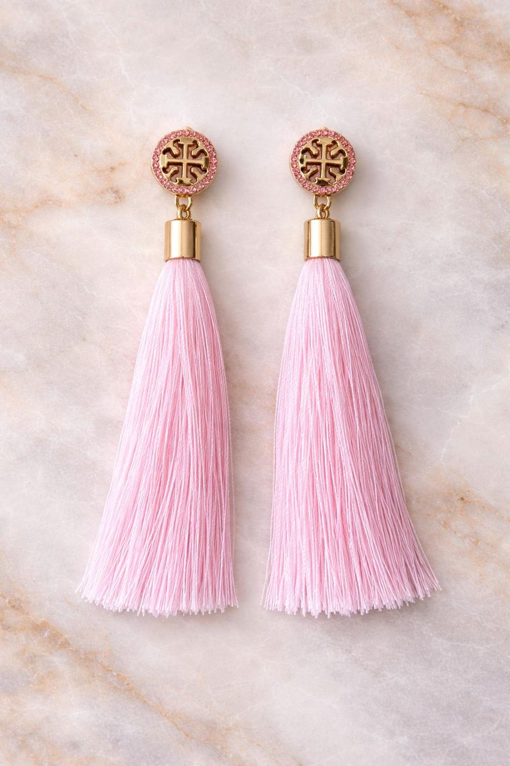 Soft blush pink tassels with golden charm accent