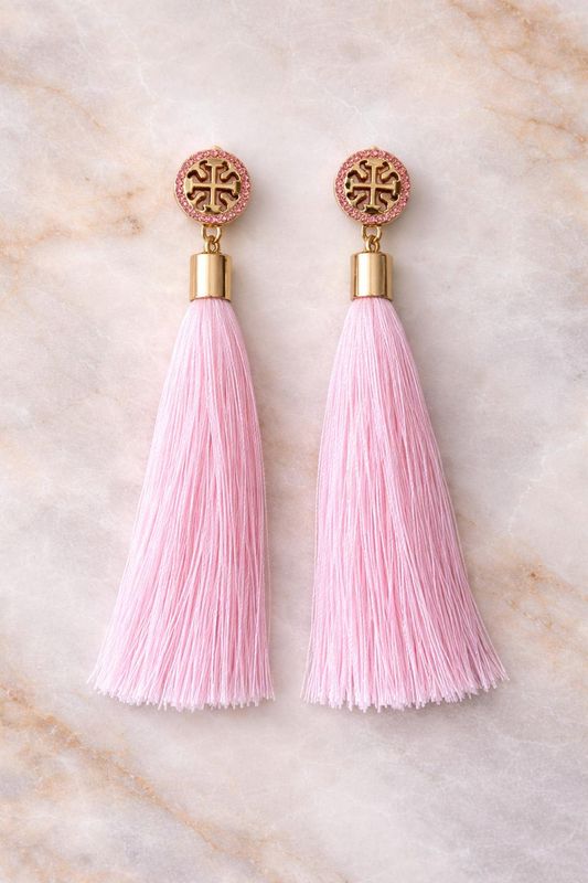 Soft blush pink tassels with golden charm accent