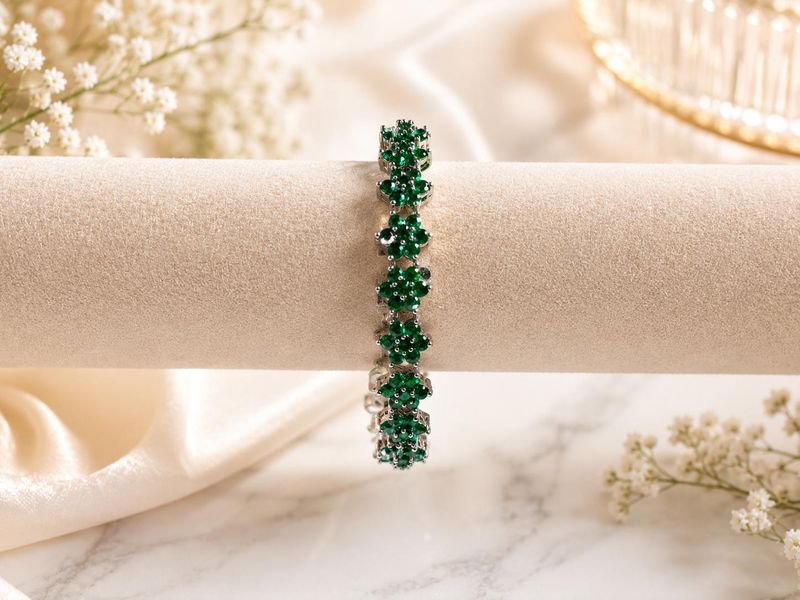 Sparkling flower shaped green stones  in a sleek silver-tone finish