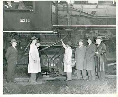 1944: Suits examining railway engine 2111, vintage 8 x 10, Louisville, Kentucky