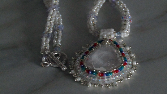 Crystal Teardrop wonderful white design with rainbow accents