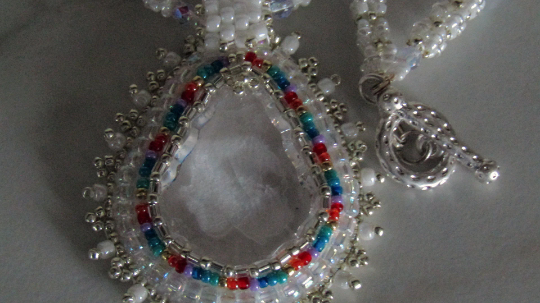 Crystal Teardrop wonderful white design with rainbow accents