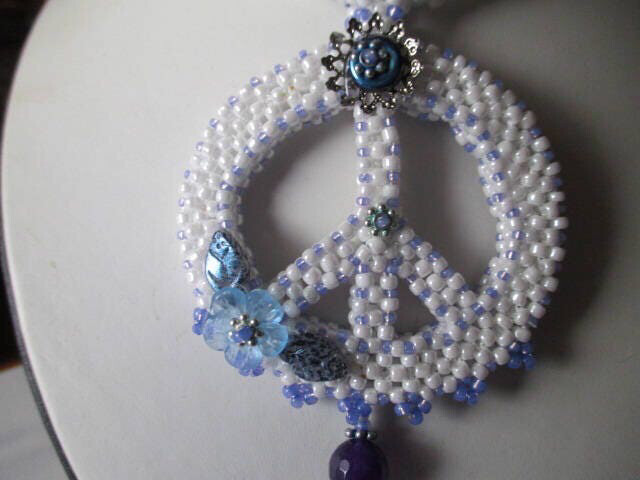 White Beaded Peace Sign with Blue and purple Accents