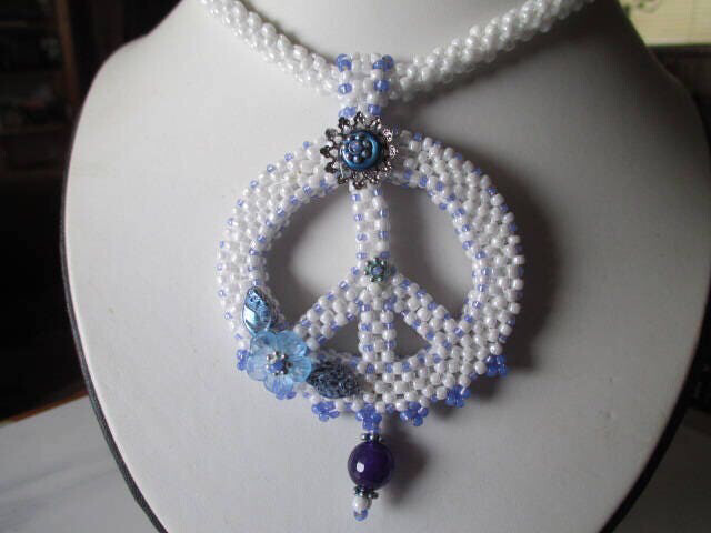 White Beaded Peace Sign with Blue and purple Accents