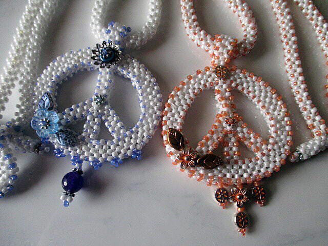 White Beaded Peace Sign with Blue and purple Accents