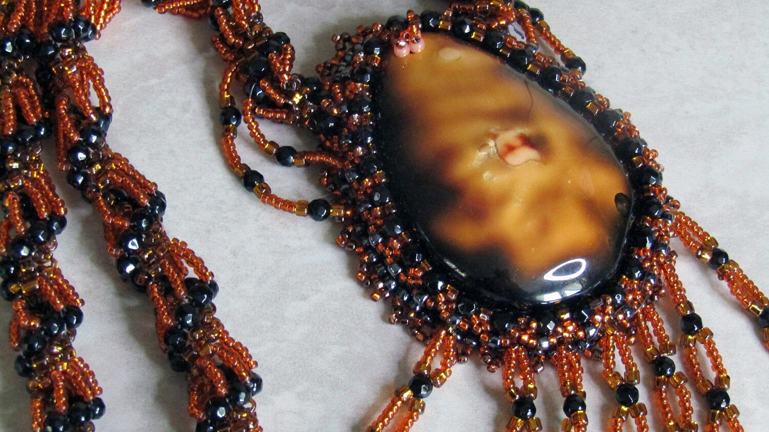 Volcano Lava Beaded Necklace with a twisted chain.