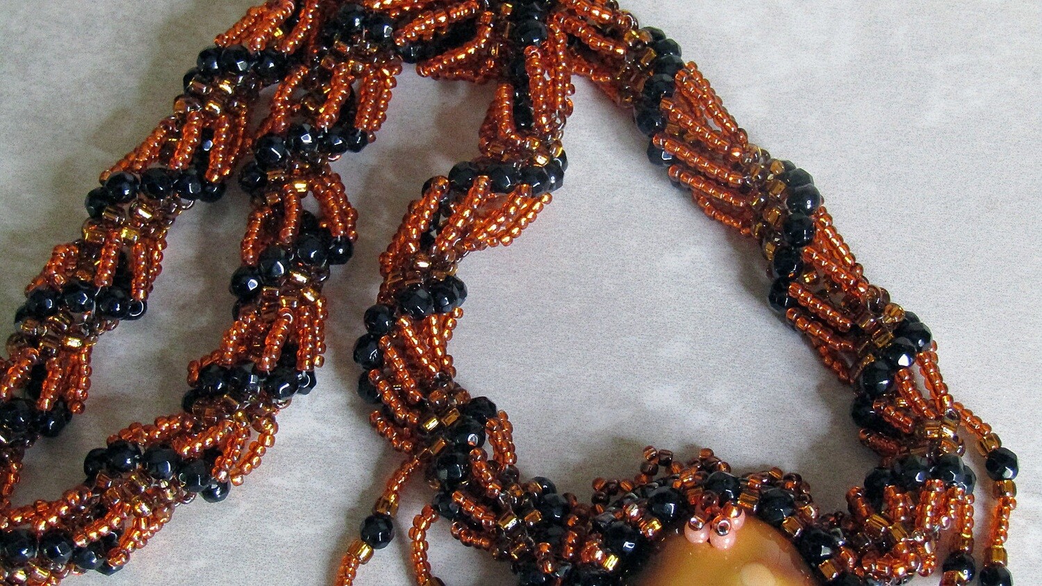 Volcano Lava Beaded Necklace with a twisted chain.
