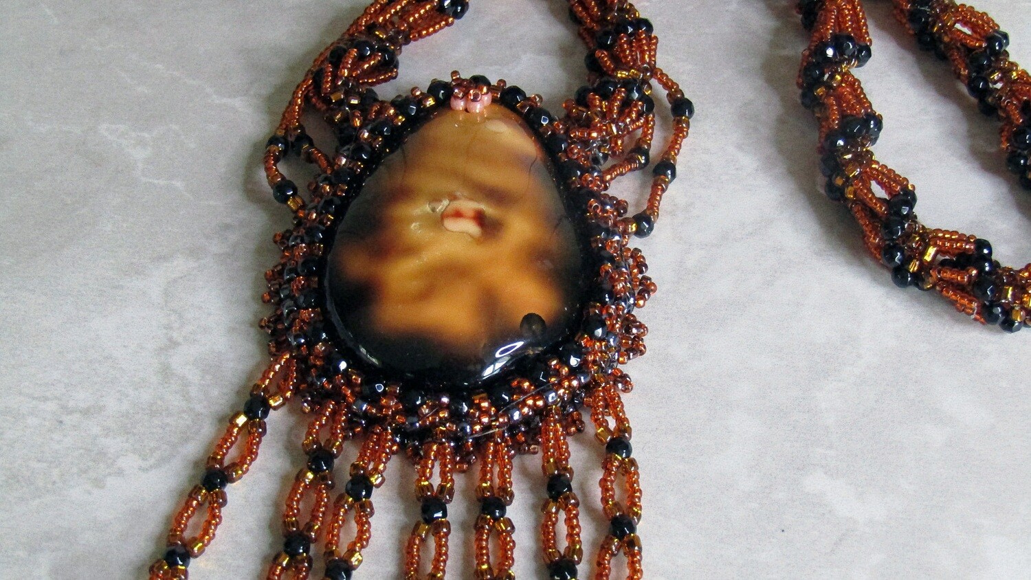 Volcano Lava Beaded Necklace with a twisted chain.