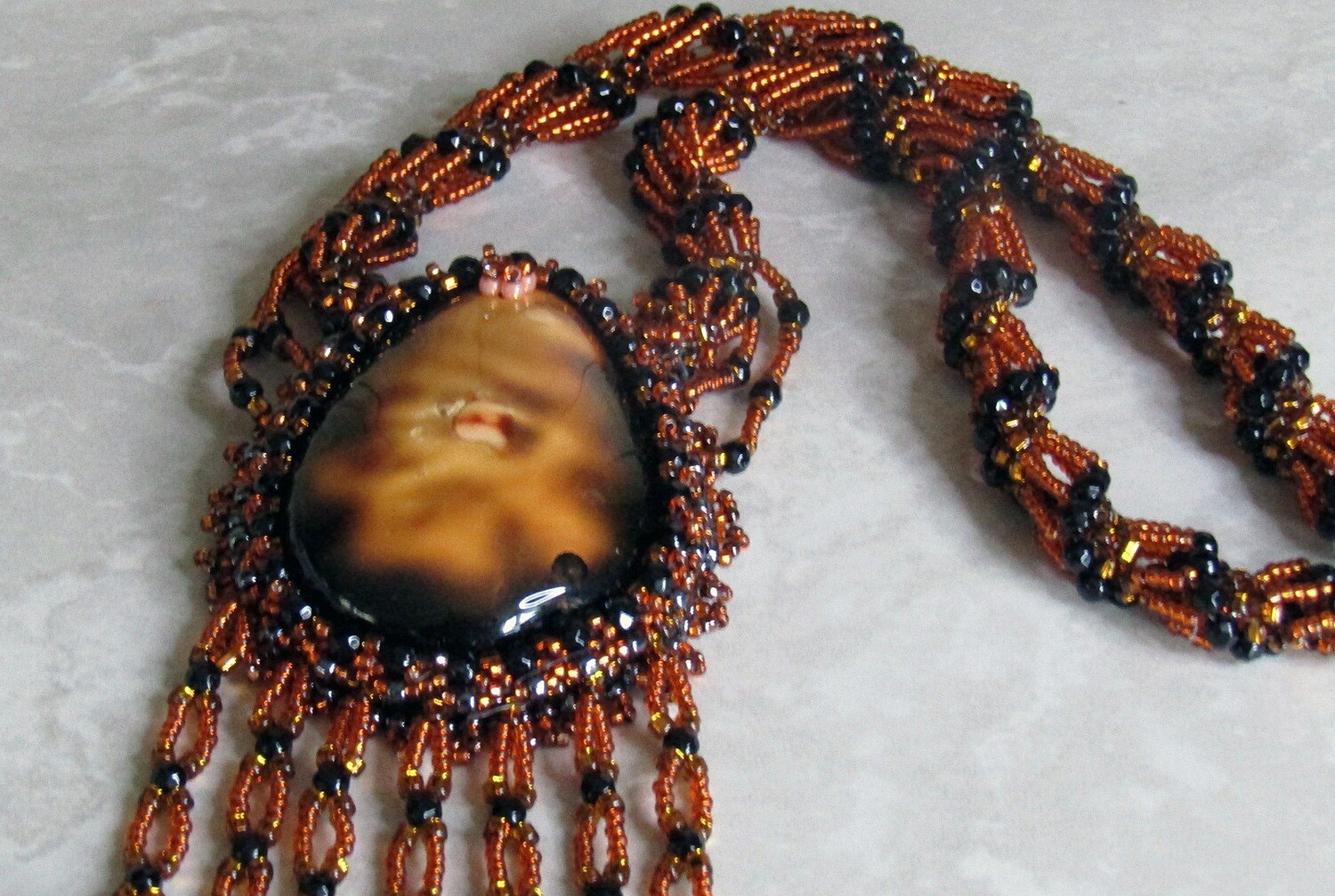 Volcano Lava Beaded Necklace with a twisted chain.