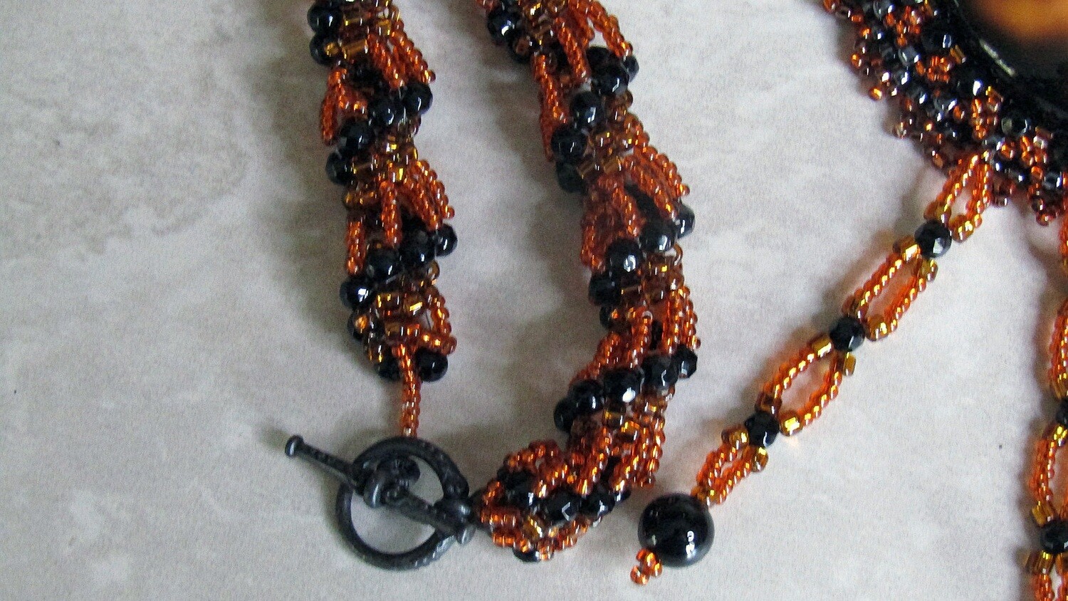 Volcano Lava Beaded Necklace with a twisted chain.