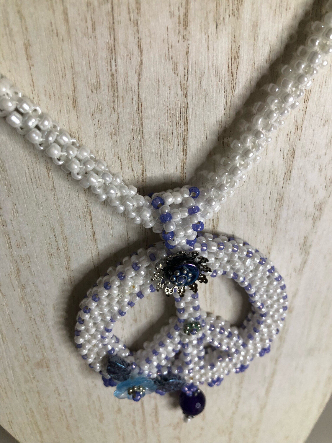 White Beaded Peace Sign with Blue and purple Accents