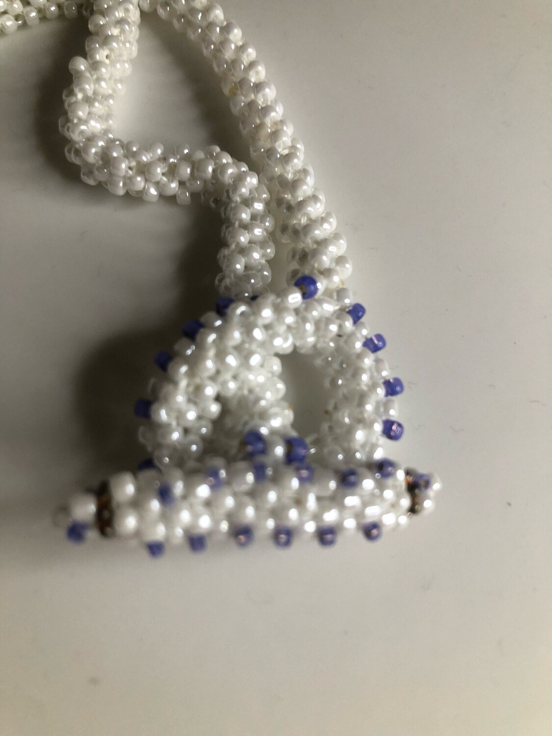 White Beaded Peace Sign with Blue and purple Accents