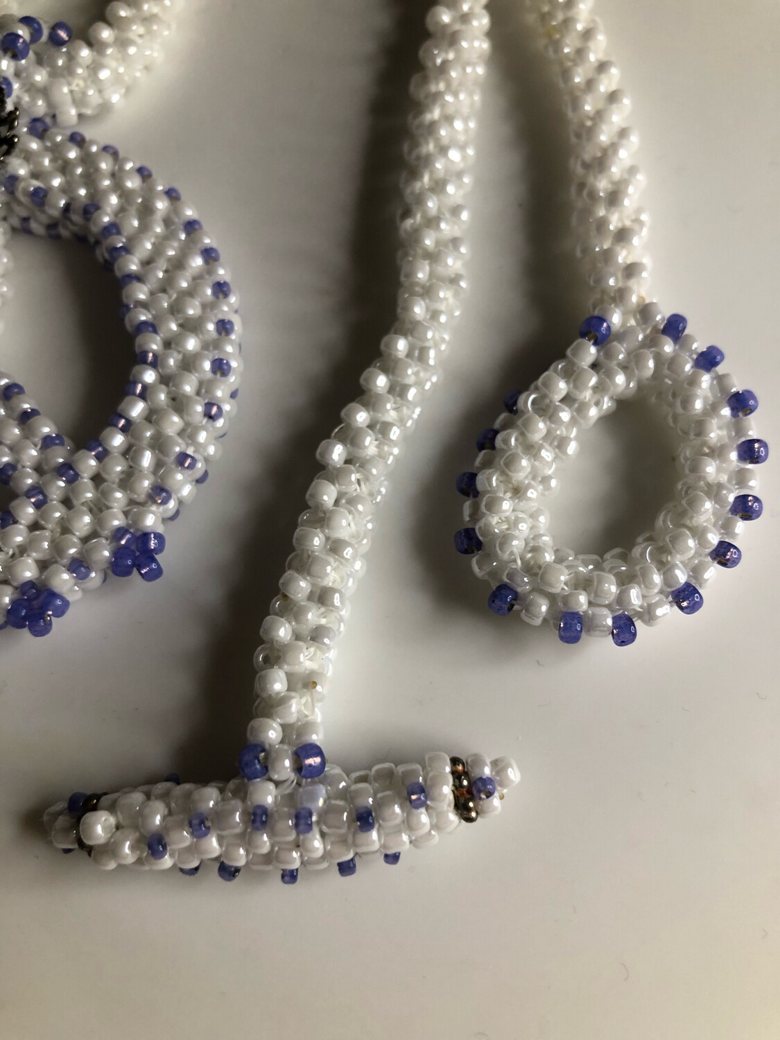 White Beaded Peace Sign with Blue and purple Accents