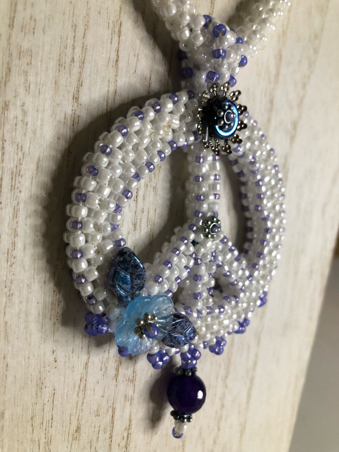 White Beaded Peace Sign with Blue and purple Accents