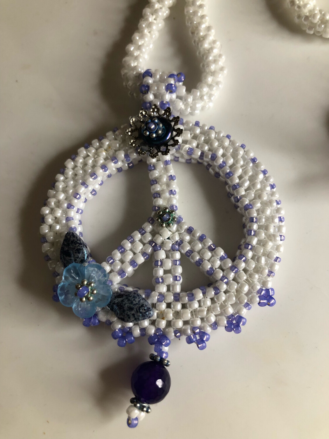 White Beaded Peace Sign with Blue and purple Accents