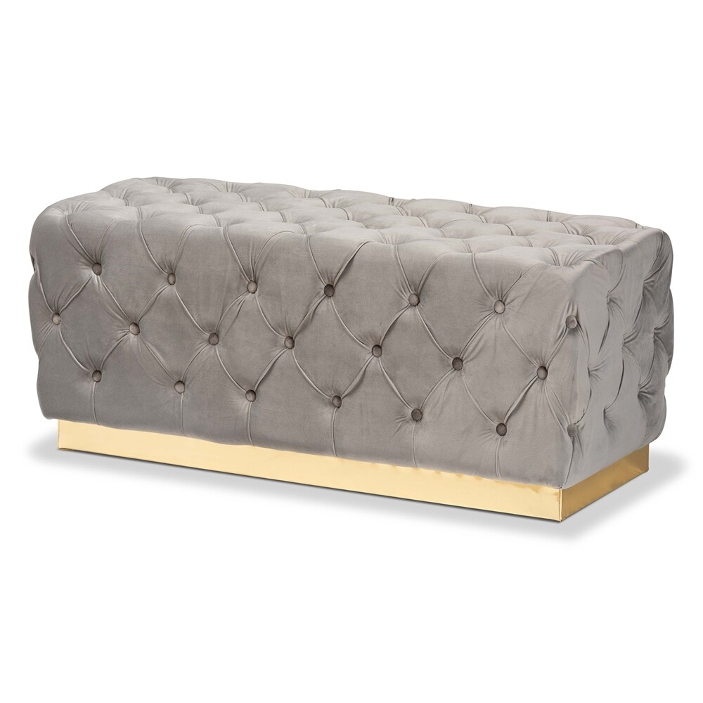 BAXTON STUDIO CORRINE GLAM AND LUXE GREY VELVET FABRIC UPHOLSTERED AND GOLD PU LEATHER OTTOMAN