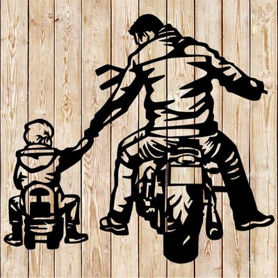 Father and son biker partners for life cutting file