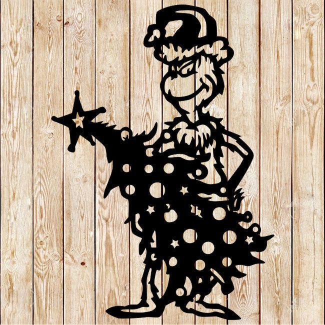 Christmas Grinch holding tree cutting file