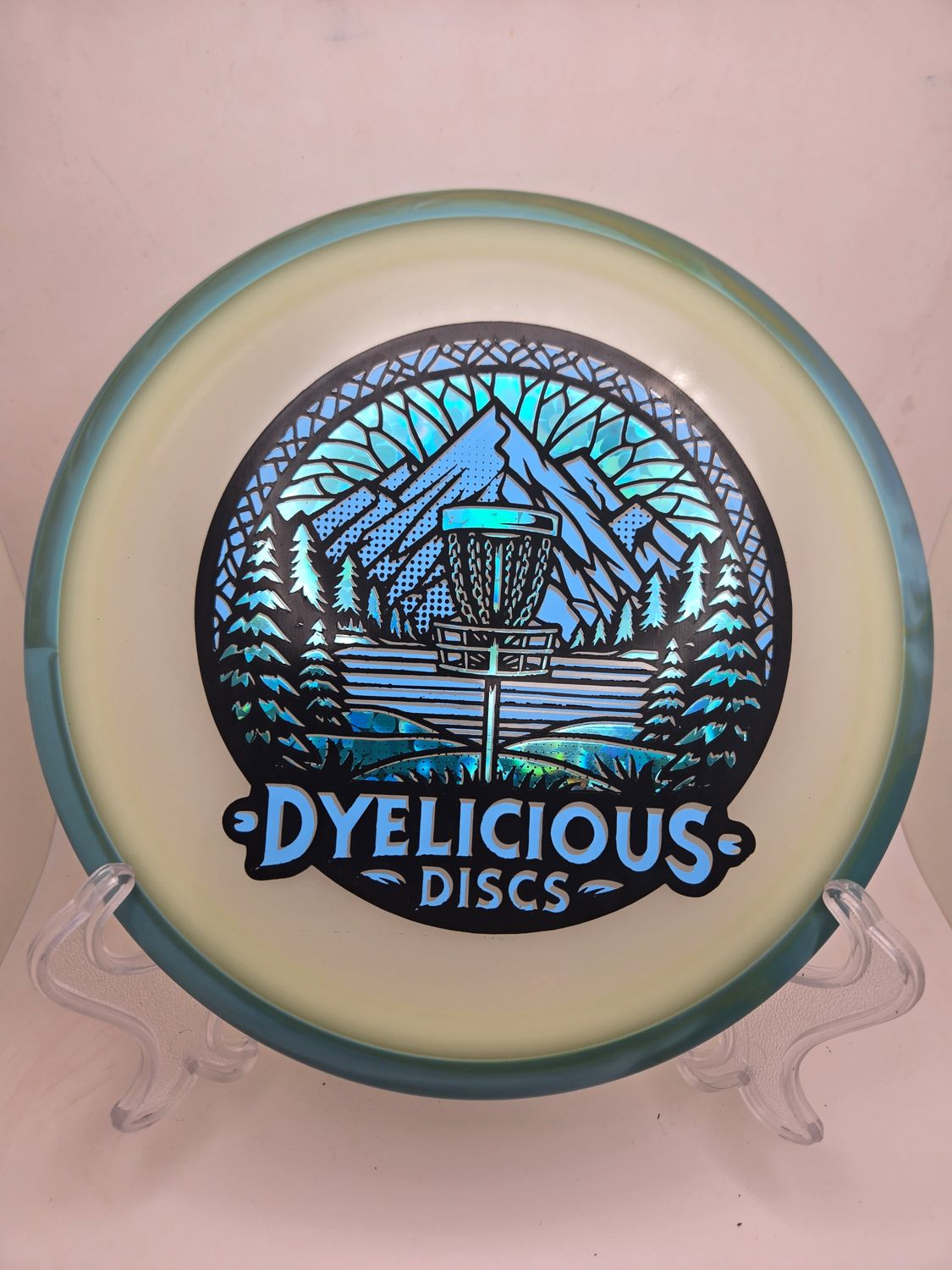 Axiom Discs Virus - Eclipse Green with Blue/Orange Swirly Rim Triple Foil 1 of 1 Dyelicious Discs Stamp with Blue Flower background and Blue stamp 175g