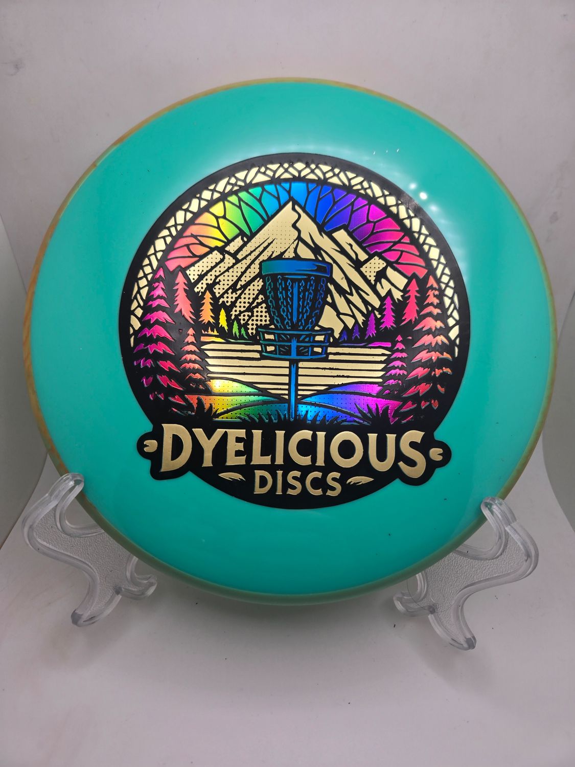 Axiom Discs Proxy Neutron Soft Triple Foil 1 0f 1 Dyelicious Discs Stamped Mint Green with Swirly Green/Orange Rim with Gradient background and with Gold Stamp 174g