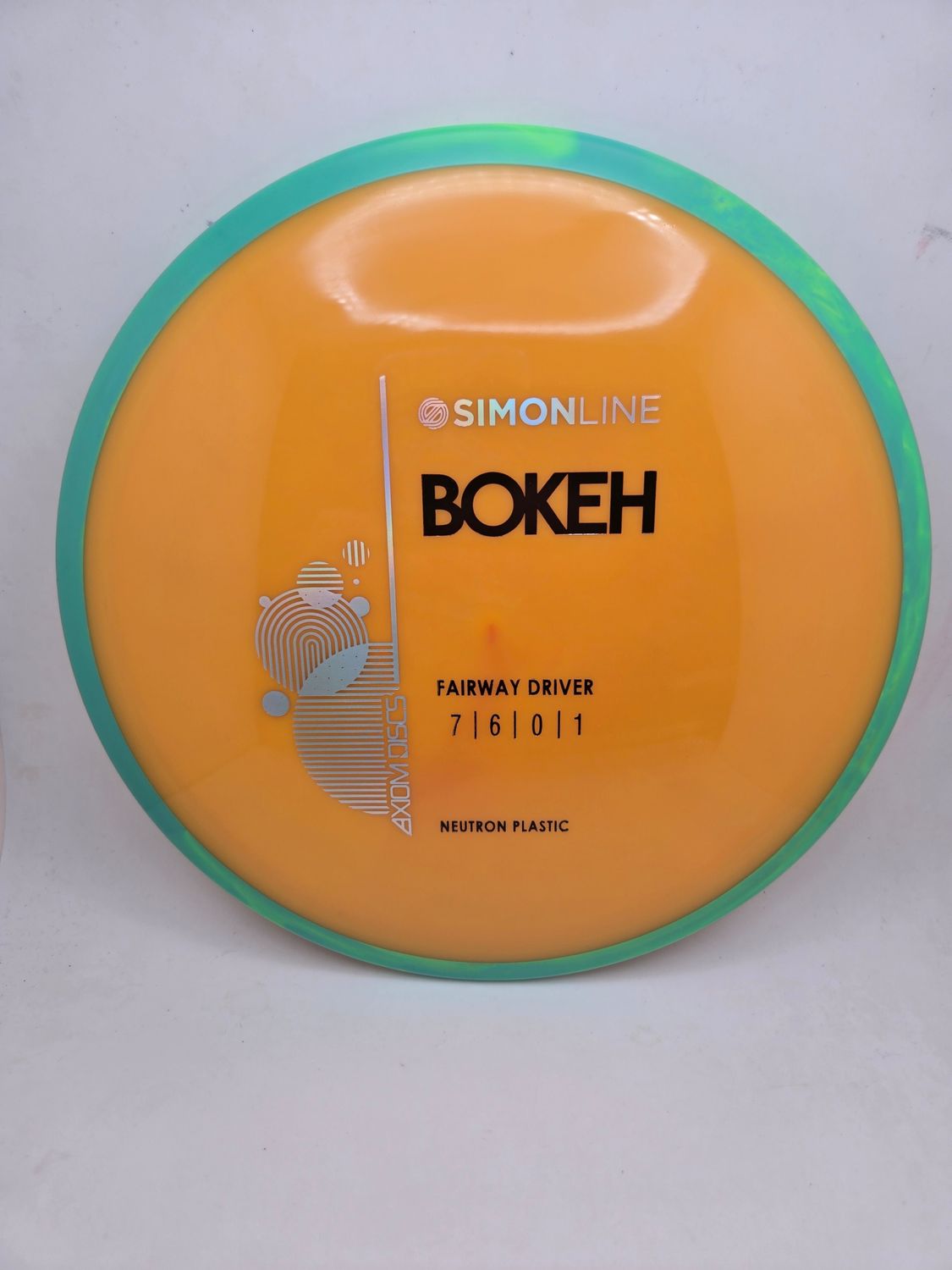 Axiom Neutron Bokeh - Stock Orange with Green/Teal Rim 167g