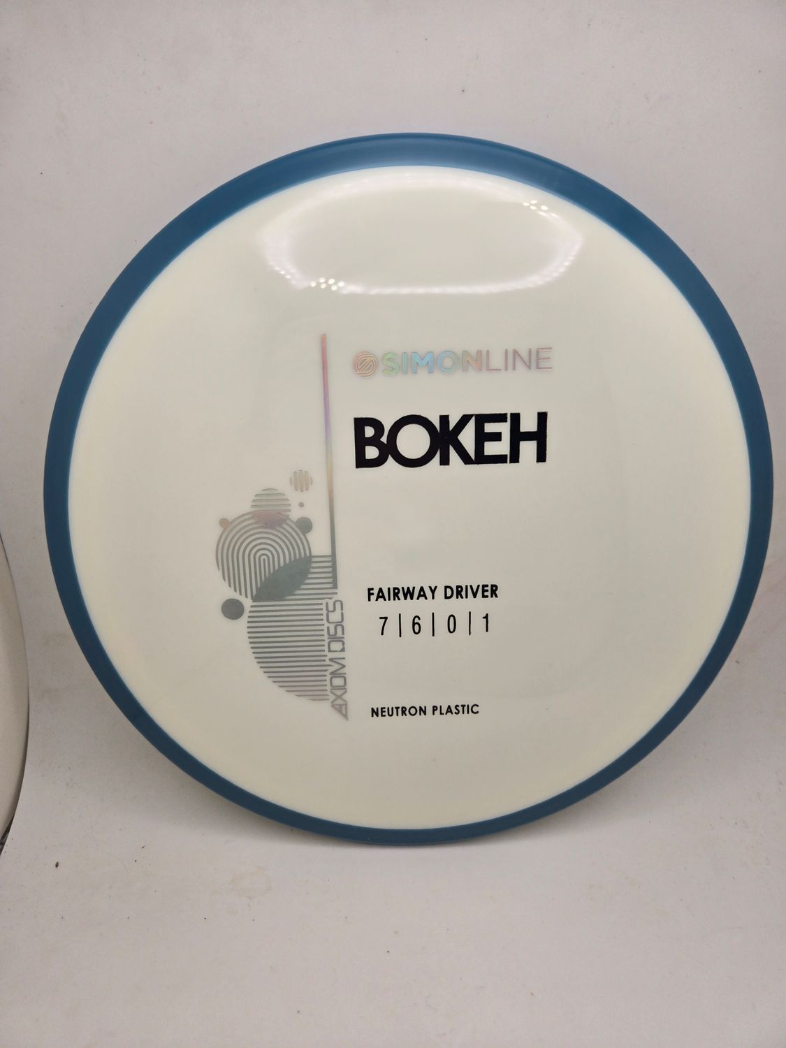 Axiom Neutron Bokeh - Stock White with Blue Rim 173g