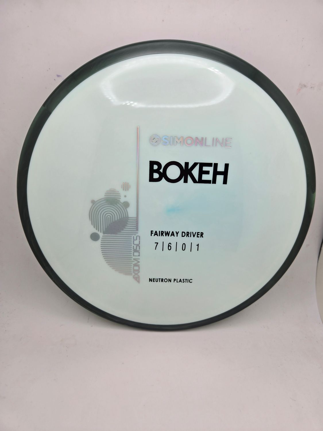 Axiom Neutron Bokeh - Stock Light Blue with Black Rim 167g