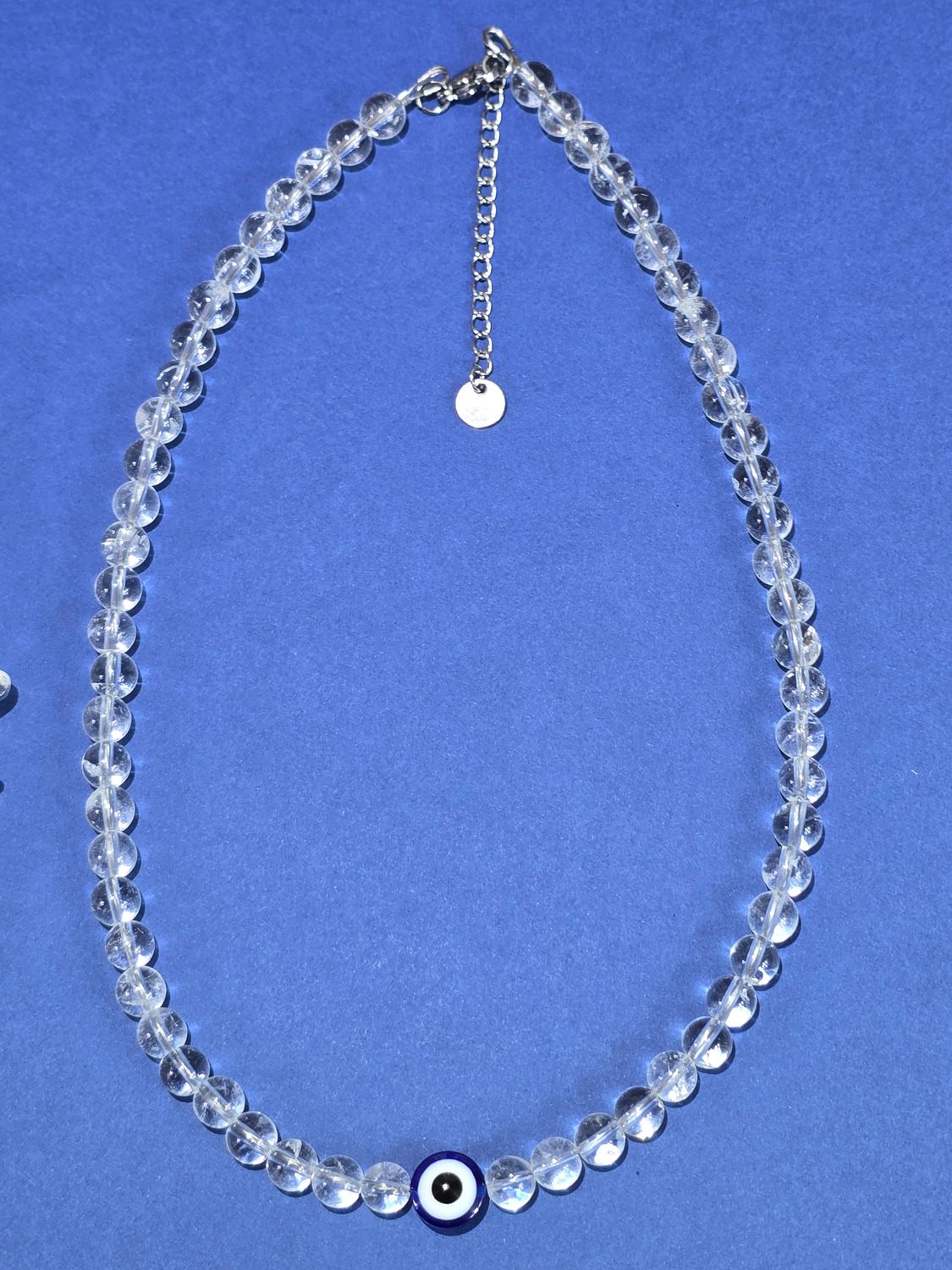 Collier cristal de roche 6mm œil bleu (40cm plus extension 5cm)